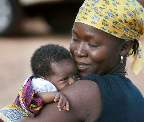 Community health education session with women and children